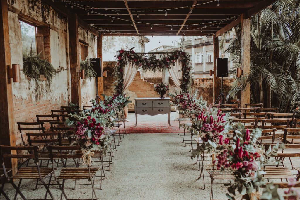 Beautiful shot of a decorated outdoor wedding venue with pink flowers