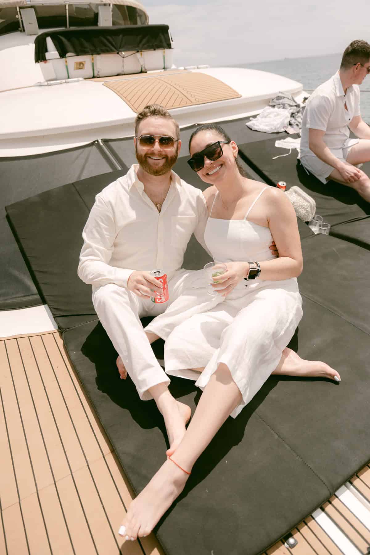 Jacqueline and Andrew together aboard the catamaran during their pre-wedding celebration in Lisbon.