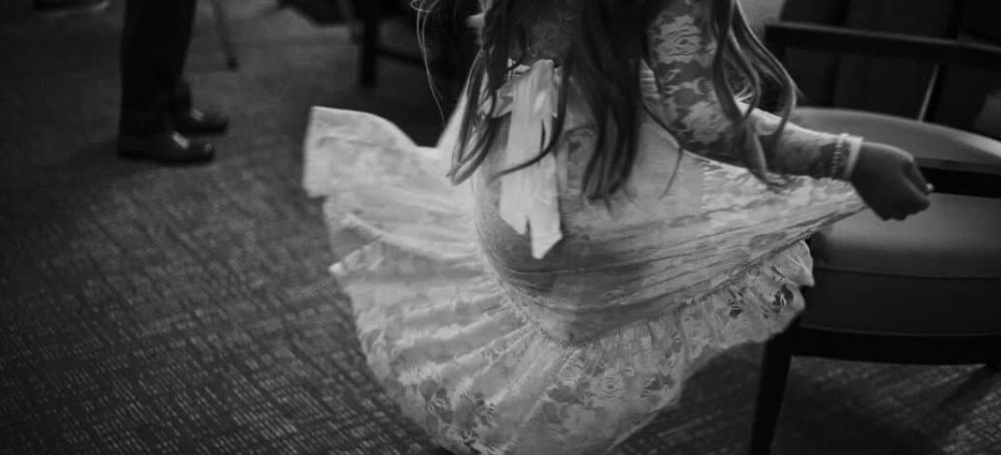 high-resolution-digital-black-and-white-photograph-of-a-little-girl-dancing-and-twirling-in-a-white_t20_loLv0B